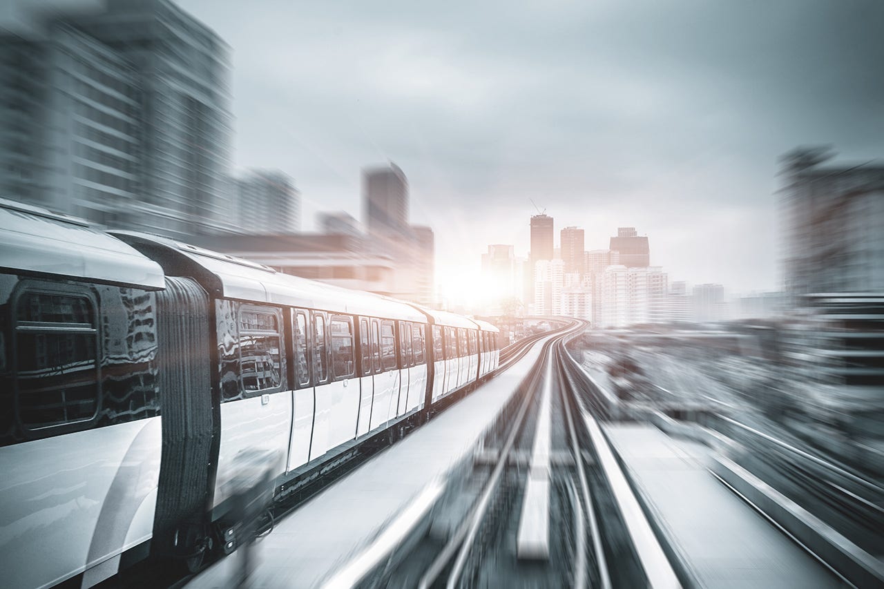 Sky train drives through the city center in Kuala Lumpur, with fast moving cityscape. Processed with Brand Fresh-up filter. Shutterstock: 166642046