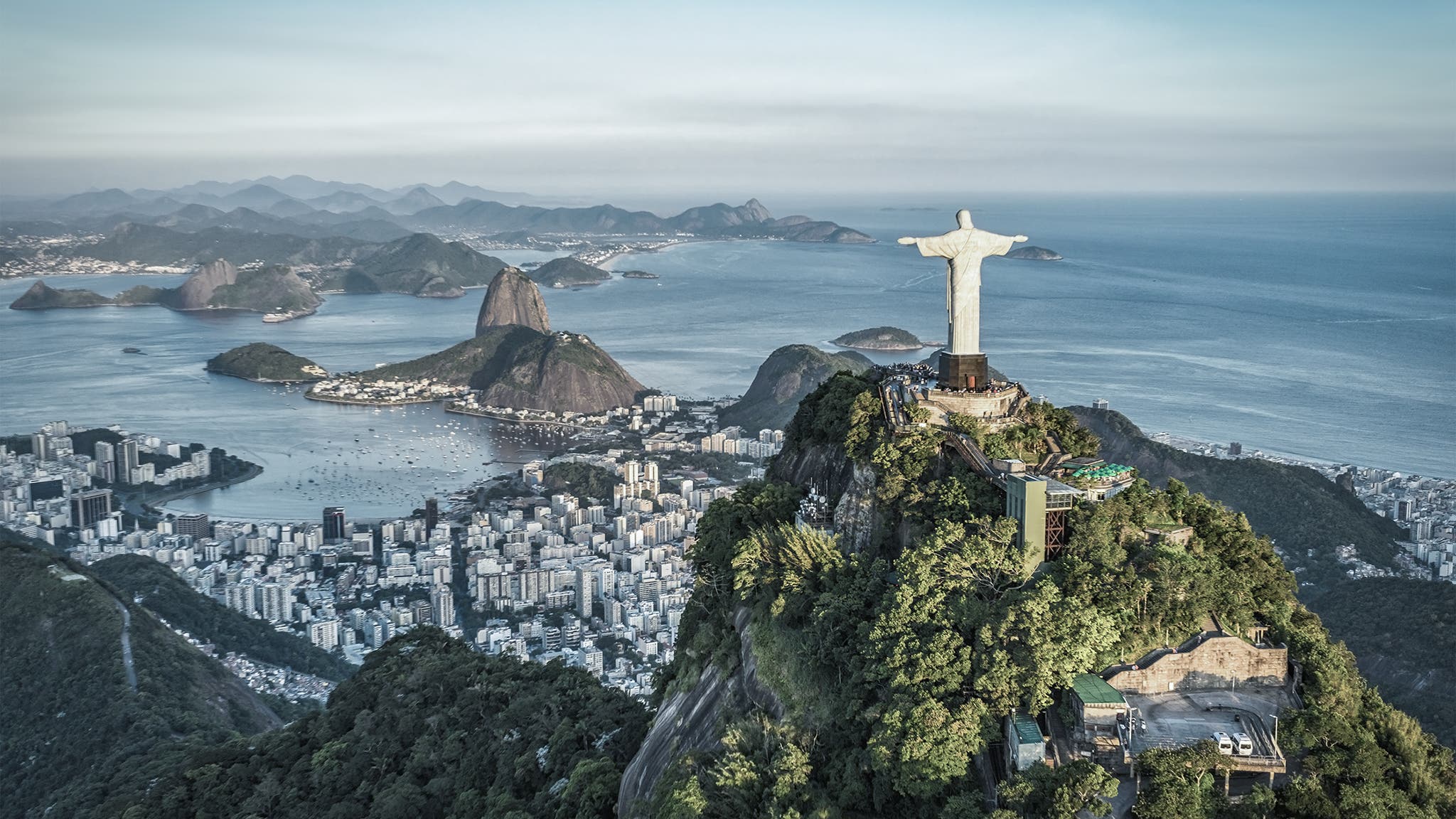 Aerial panorama of Christ and Sugar Loaf Mountain, Rio De Janeiro, Brazil. Vintage colors