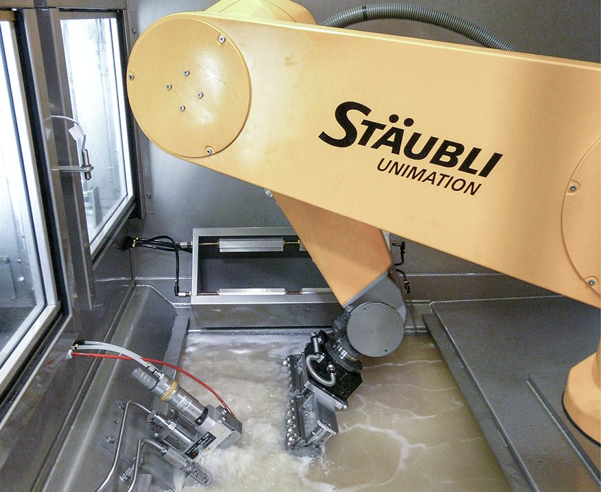 Water jet deburring with a RX160 robot