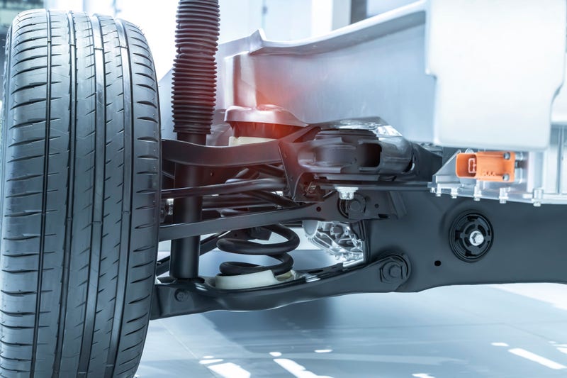 Car front driving axle in the car, visible elements of the steering system