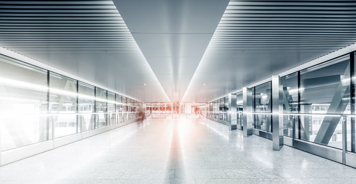 Key visual with a corridor at the Zurich Airport, edited with brand fresh-up filter, magic light effect and cut in detail image 2/3 size to use in Template B on the website.