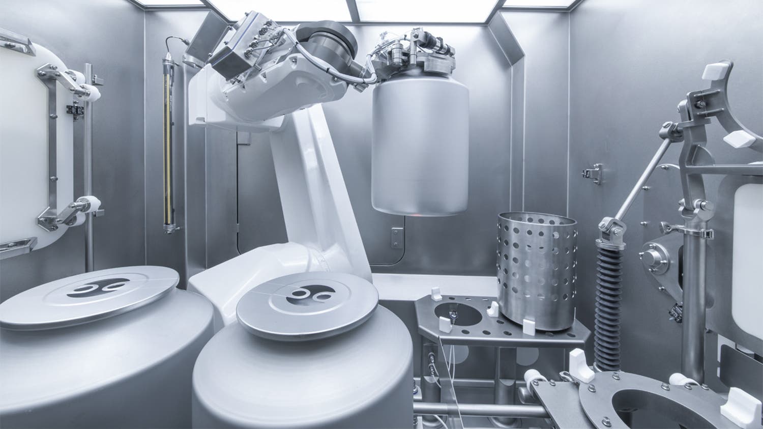 A Stericlean RX160 robot is manipulating active substances bucket in API production cell.