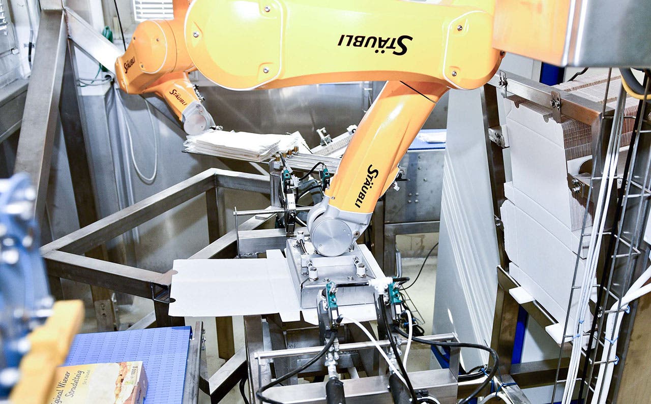 During peak apple strudel season, robots Sissi and Franz work together around the clock.