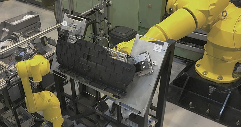 Robot and injection molding machine working in harmony
