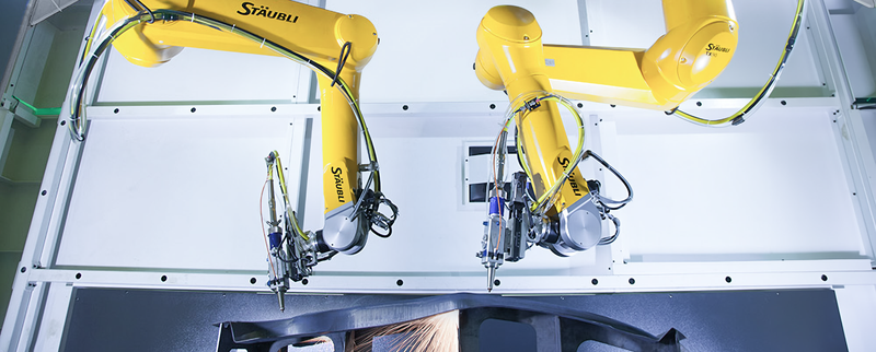 Laser cutting application with two ceiling-mounted TX2 Stäubli robots.