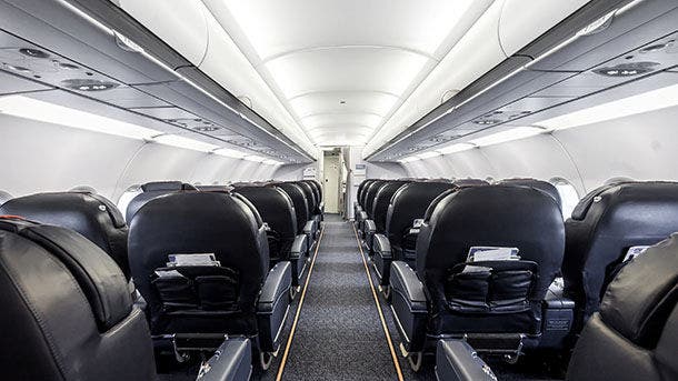 Interior of the passenger airplane with leather seats.