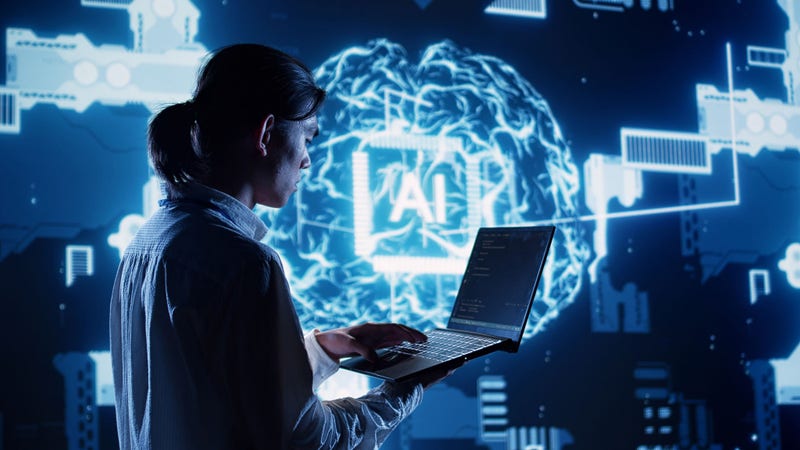 System admin in data center running programming scripts on laptop, solving tasks. Certified developer manipulating lines of code for artificial intelligence applications development; Shutterstock ID 2461049629; purchase_order: BAUDILLON Cassandre