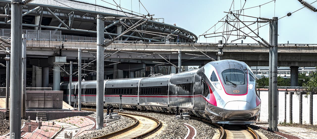 High-speed train leaving train station, Fuxing, Chinese railway