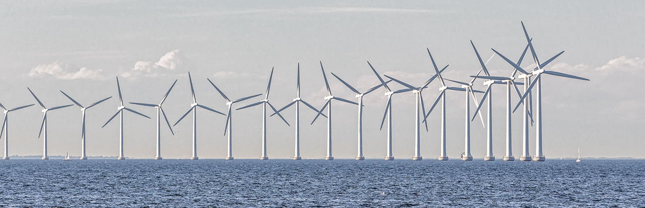 Panorama of Offshore Wind Turbines in cloudy weather near Copenhagen, Denmark