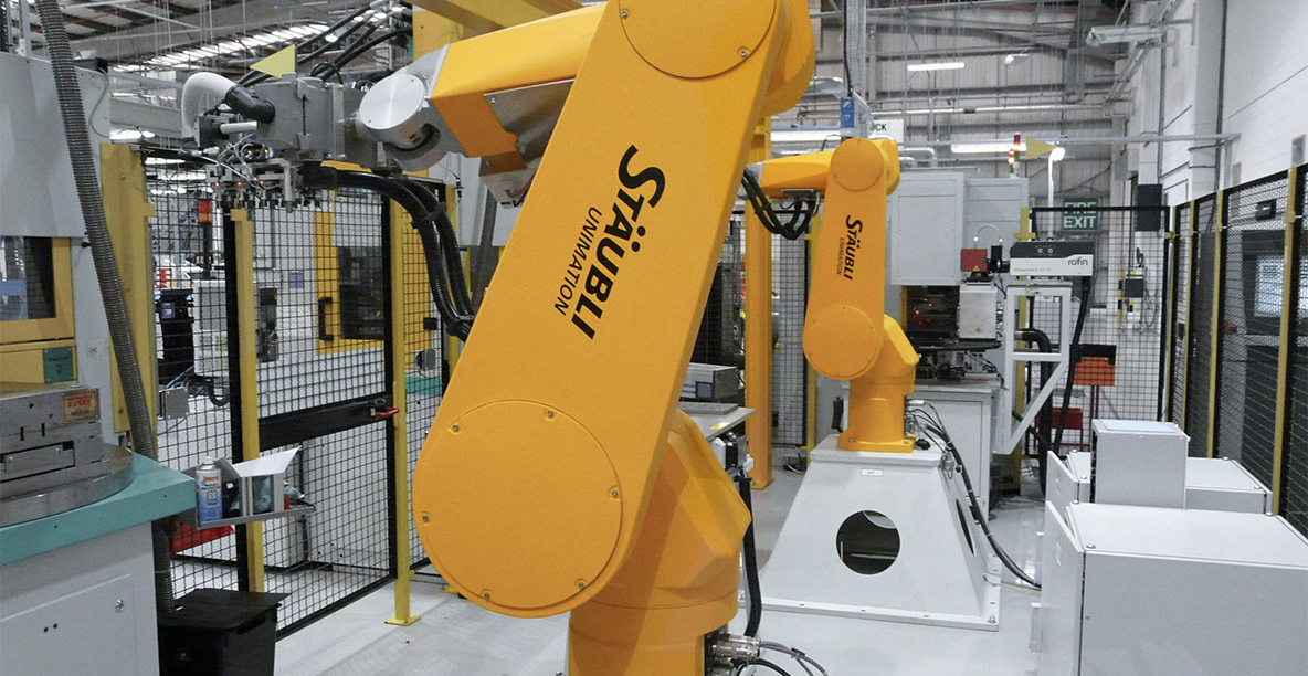 Two Stäubli RX160s are responsible for handling the module in the overmolding cells.