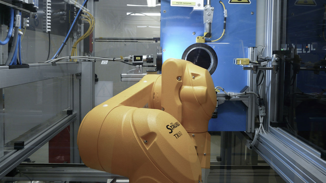 Robot-assisted X-ray inspection facilitates zero-defect production of vehicle side door latches.